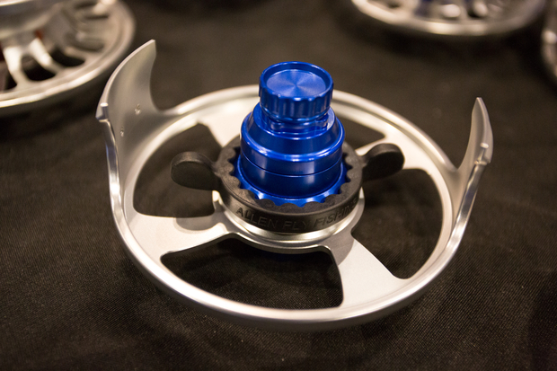 The Omega reel with drag unit (blue) attached to an Omega frame. Shown is the provided tool for swapping the drag unit. Allen Omega Fly Reel - Drag and Frame