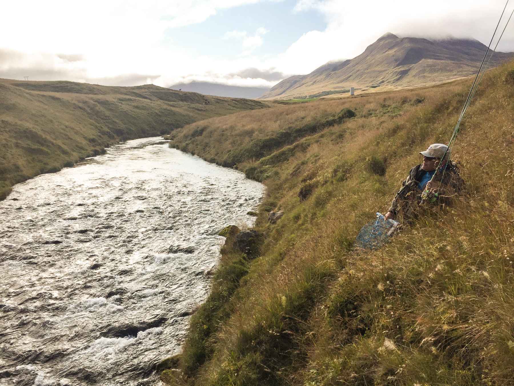 Fly fishing guide Gunnlaugur Gudleifsson rests on the grassy banks of the Fljotaa, the most beautiful river in the whole world according to him. Fljotaa river iceland