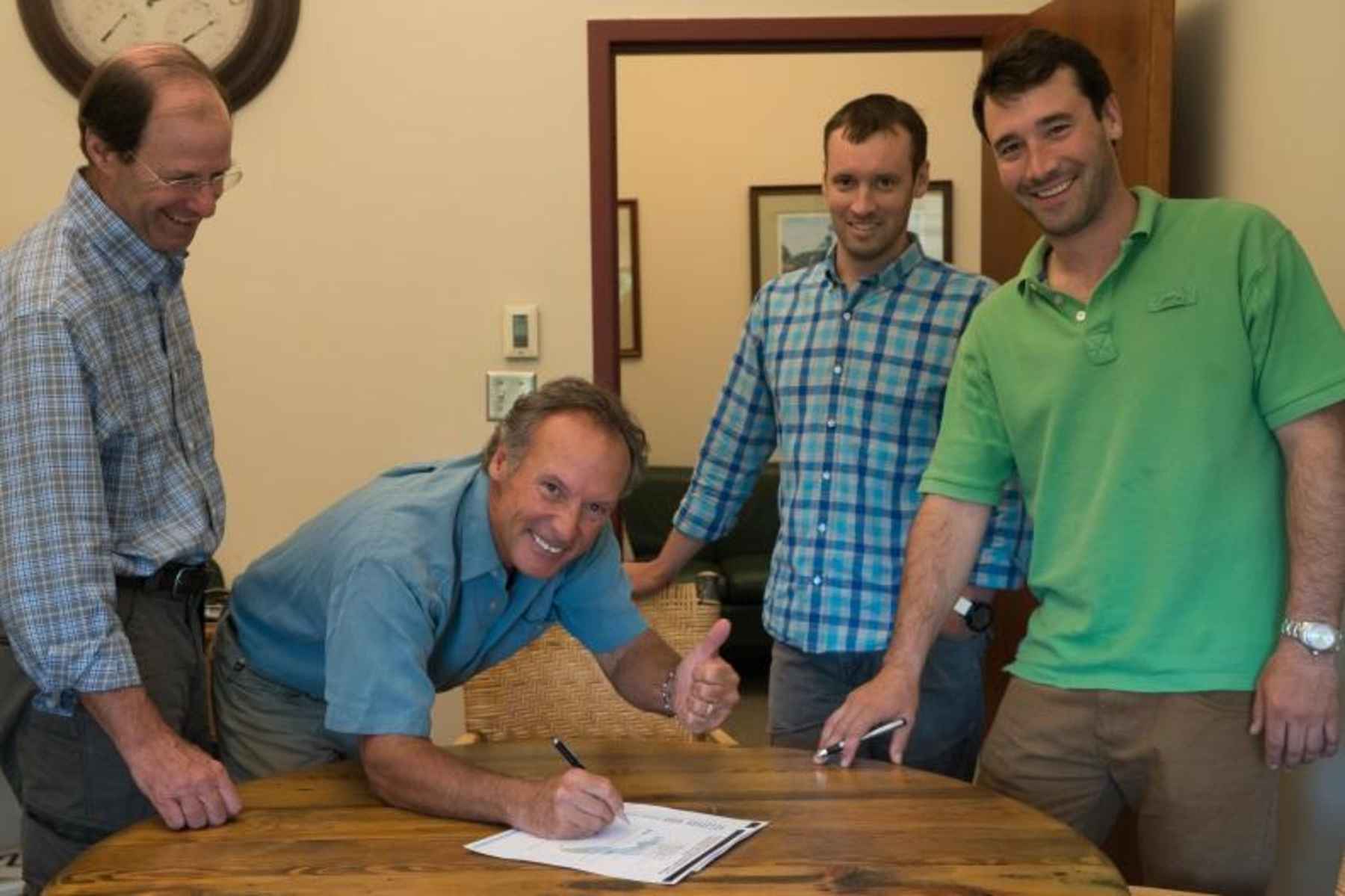 Orvis execs sign the 'Now or Neverglades' declaration. From left: president Bill McLaughlin, CEO Perk Perkins, brand director Simon Perkins, product developer Charley Perkins. Not pictured: Dave Perkins, executive vice-chairman. orvis signs now or neverglades