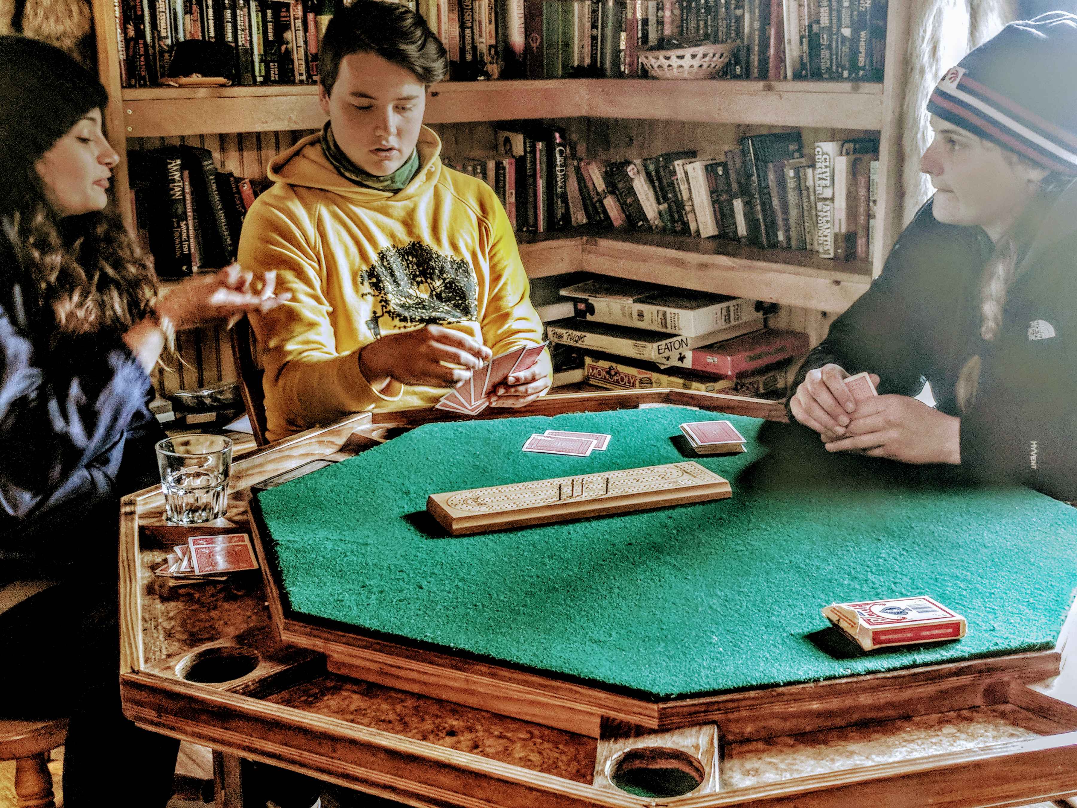 Photo: Chris Hunt playing cards at the fishing lodge