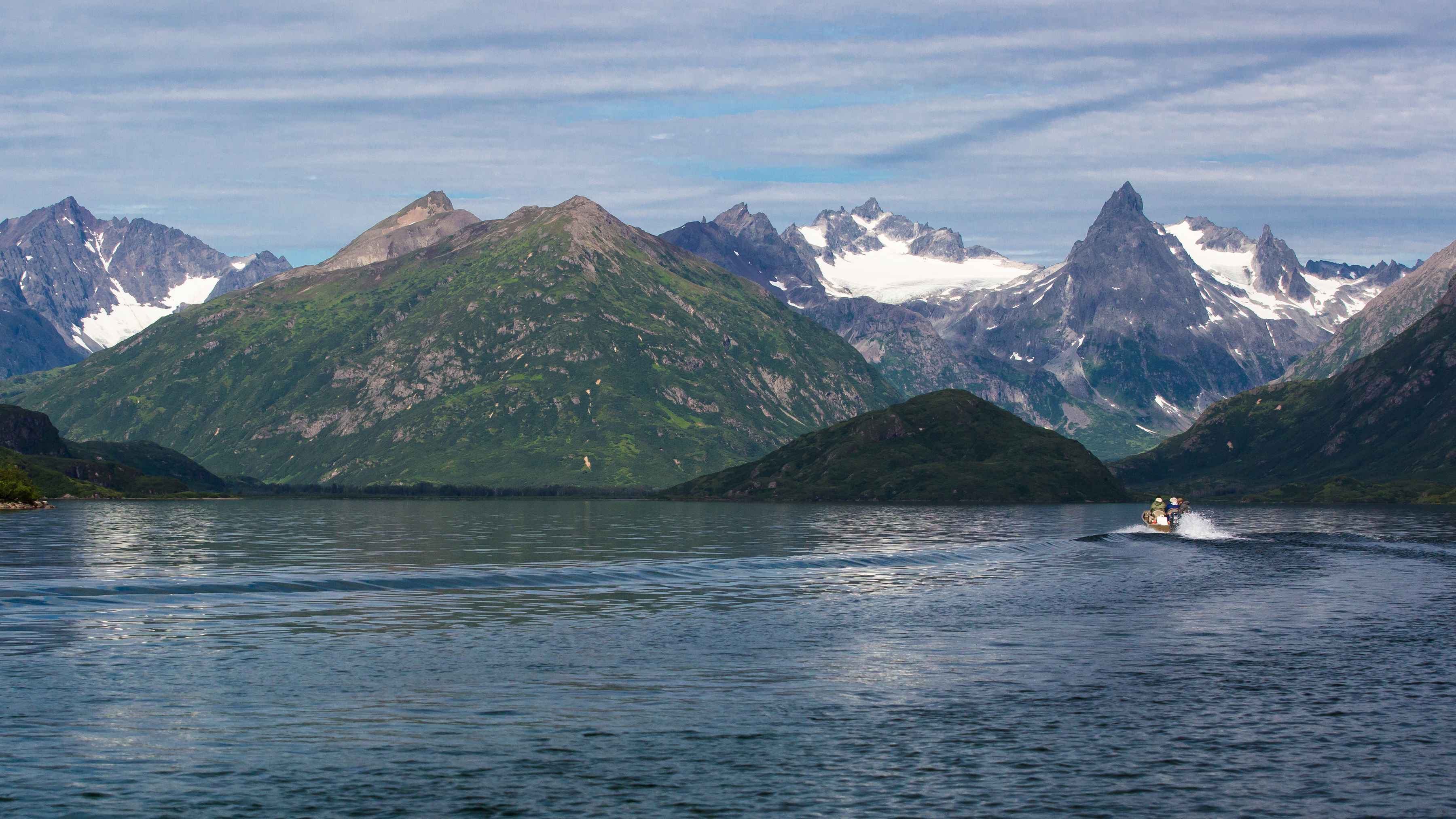 A jet boat makes it's way along the lakeshore of one of Wood Tikchik's lower system of lakes. Wood Tikchik National Park - Alaska