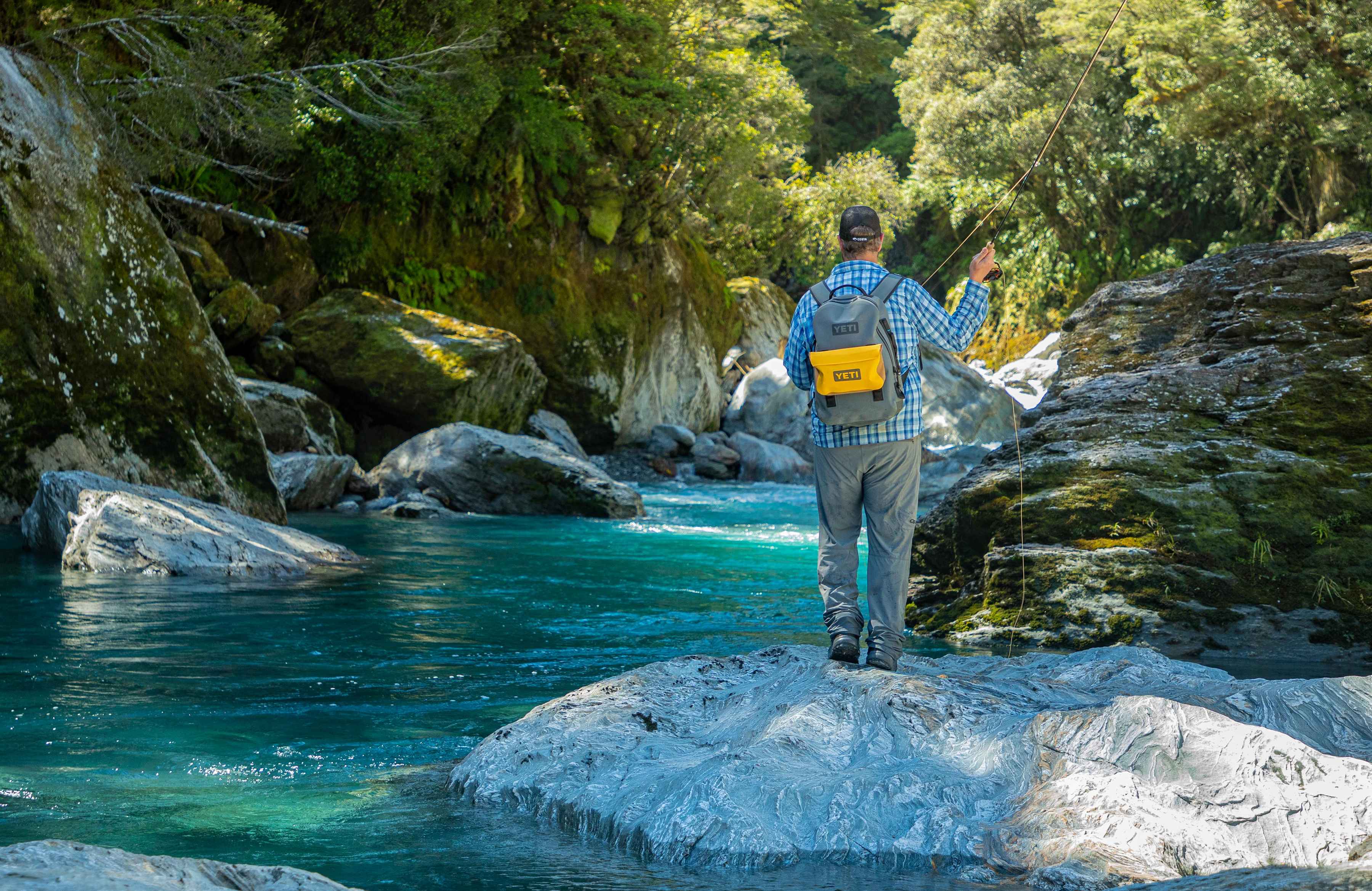 Toting the YETI Sidekick on a New Zealand creek (photo: Earl Harper). YETI Sidekick Gear Case