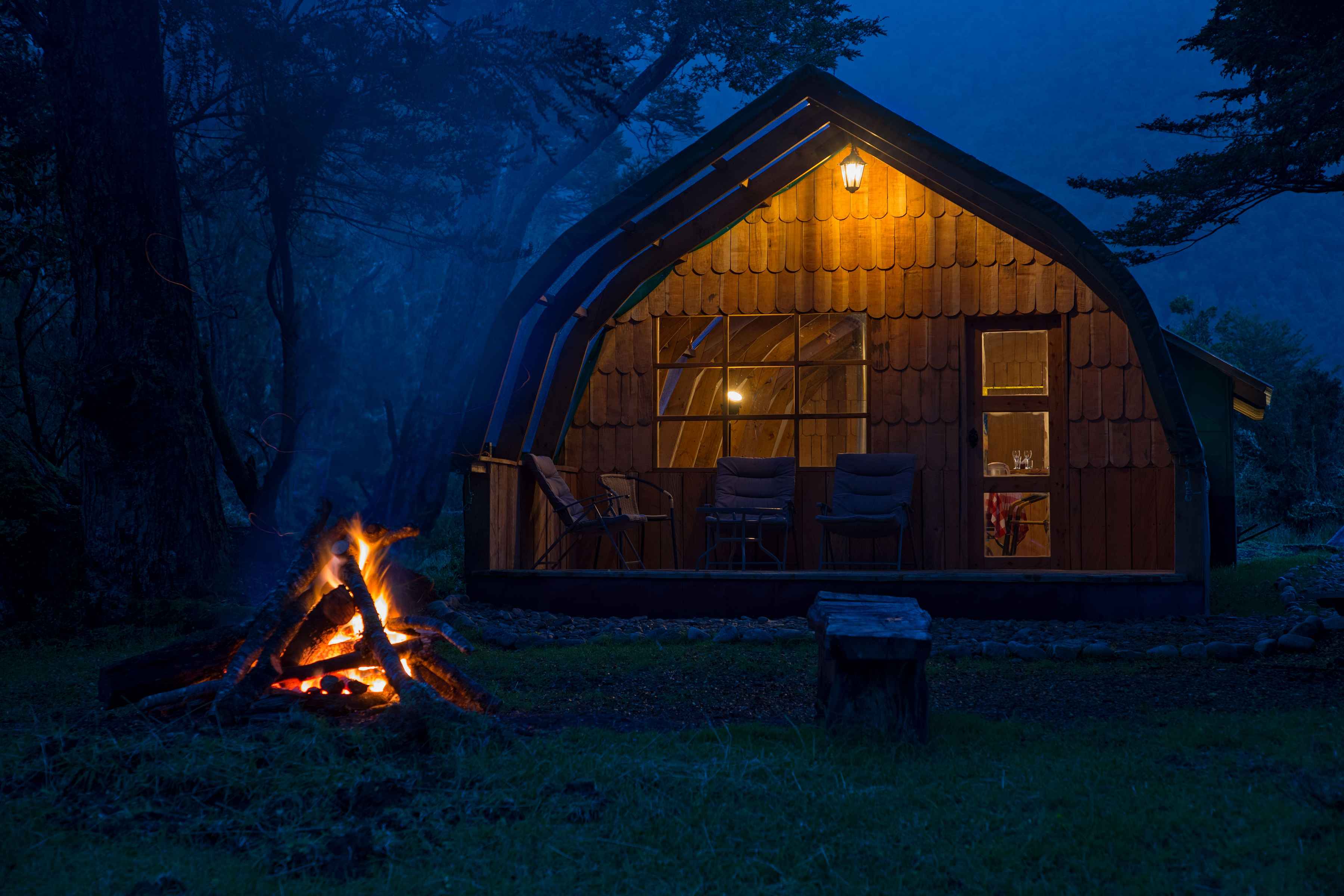 A campfire burns outside the main dining tent at the River of Dreams basecamp (photo: Earl Harper). river of dreams basecamp