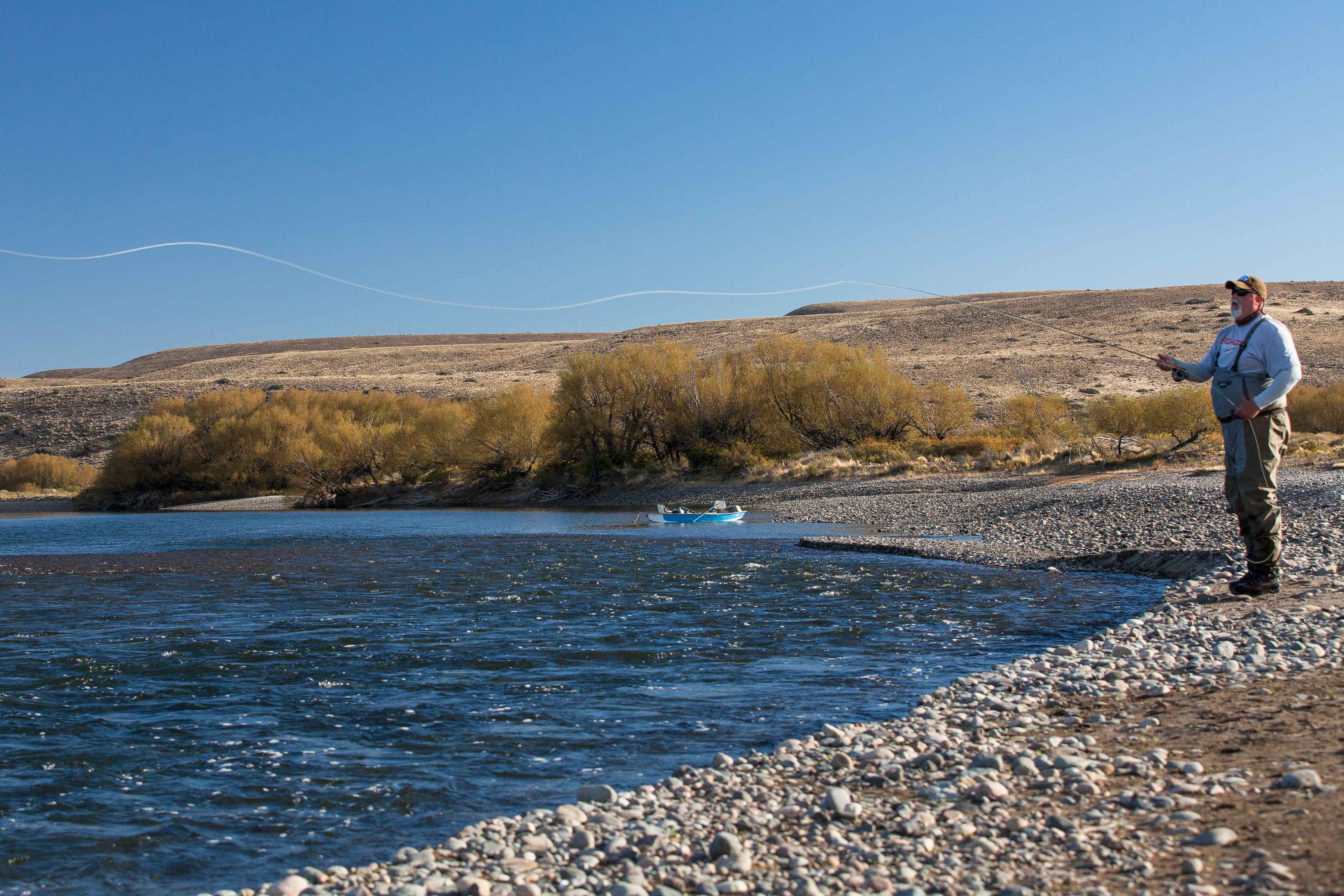 Chris Hunt tosses a cast into a riffle on the lower Collon Cura (photo: Chad Shmukler). fly fishing collon cura river