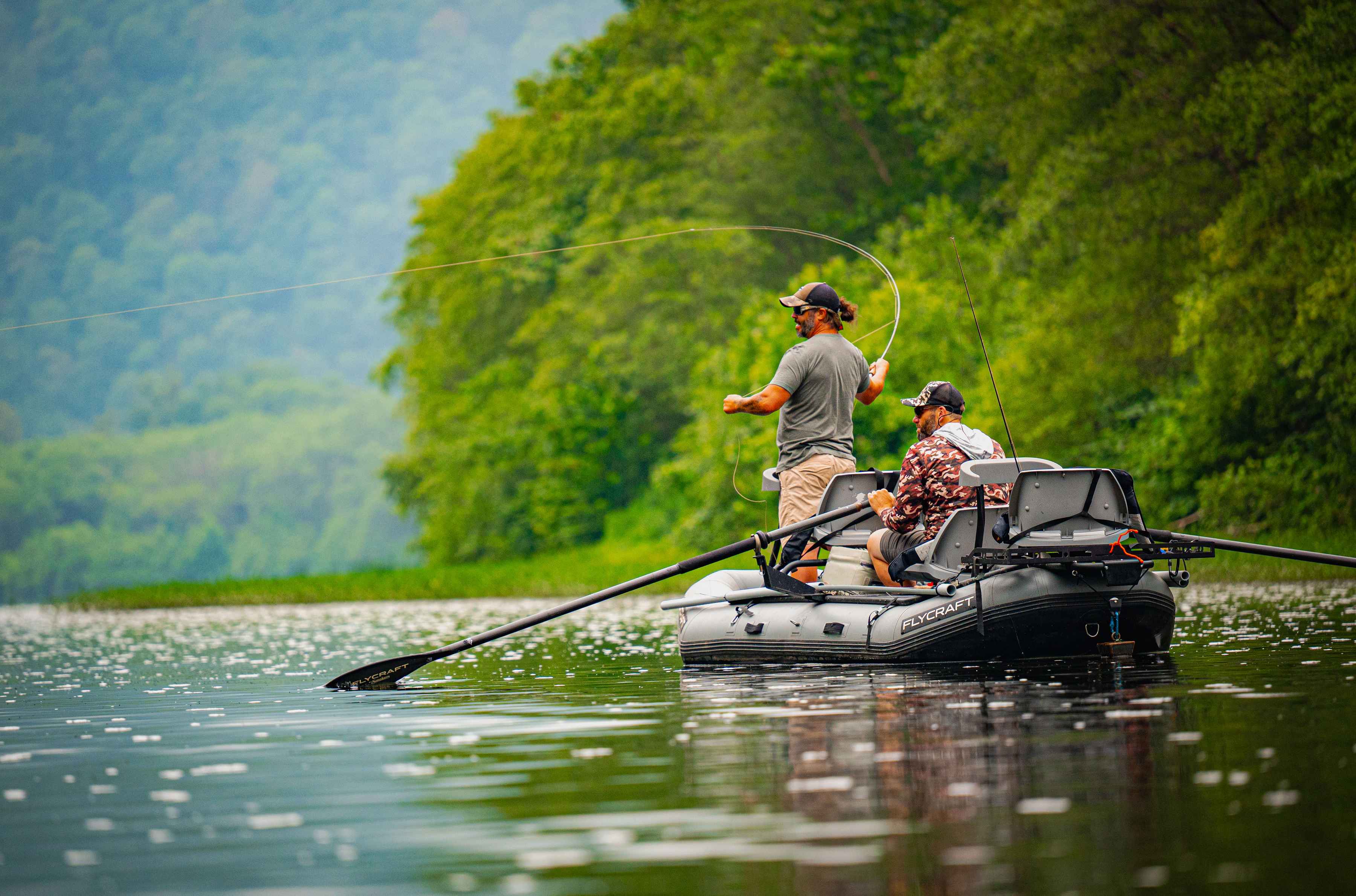 Photo: George Daniel smallmouth bass fishing flycraft raft