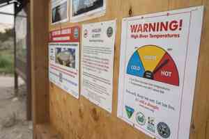 high water temperatures drought warning sign river access
