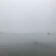 boats and fog and clouds on the lake