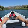 child in a drift boat