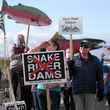 Columbia Riverkeeper member Heidi Cody joins activists calling for dam removal during a vigil for salmon