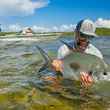 angler holding permit bahamas