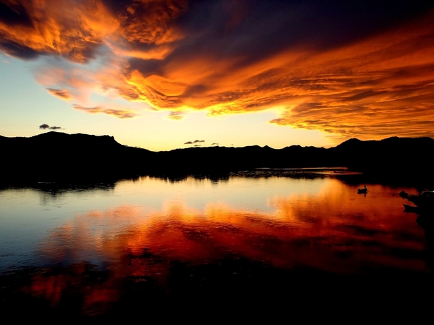 An angler makes his final casts to rising trout during sunset on the Missouri River in Montana. (photo: Alec Underwood)