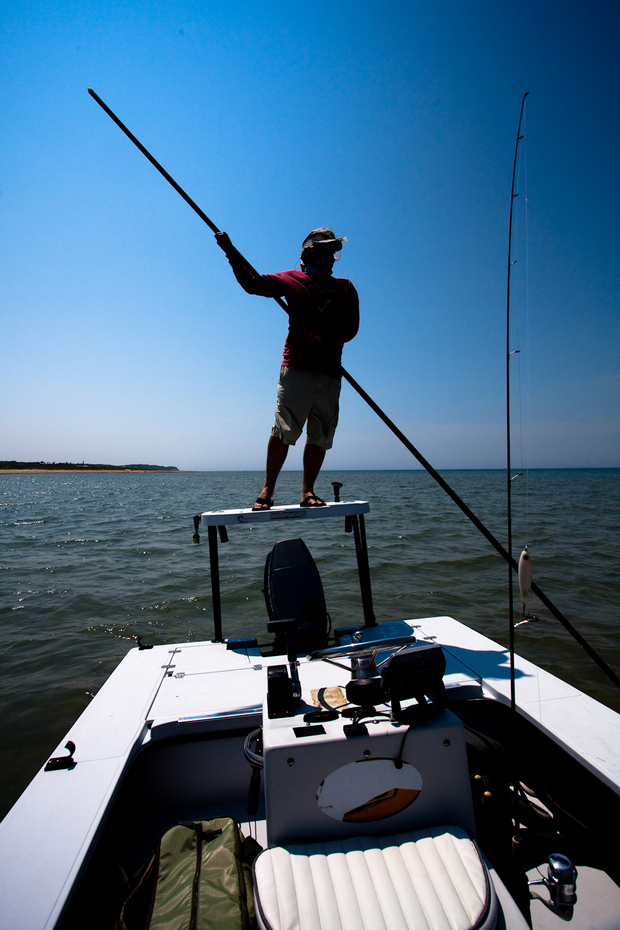 Jaime Boyle polls the boat into position. Poling the Flats Skiff