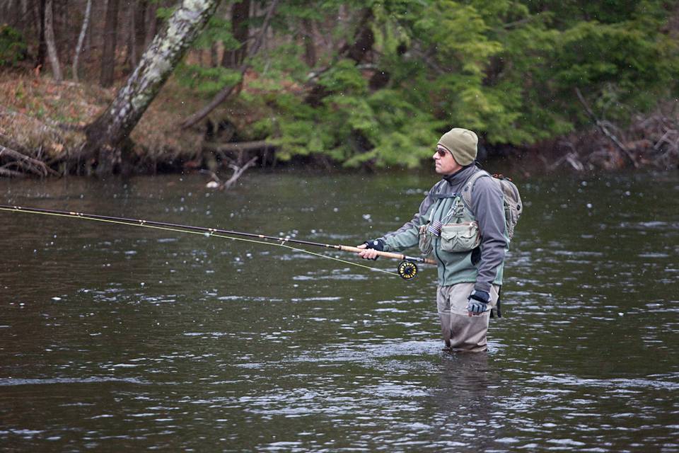 Snow falls as George Costa swings through Paradise on NY's Salmon River.