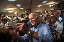 Joe Biden poses for a photo-op with campaign supporters