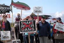 Columbia Riverkeeper member Heidi Cody joins activists calling for dam removal during a vigil for salmon