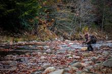 young fly fisherman stealthy approach