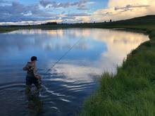 kid wading fishing