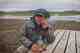 The photographer, Earl Harper, takes a break from capturing images and dodging midges on the shores of <a href='https://hatch.travel/trips/iceland/icelandic-highlands?utm_source=hatchmag&utm_medium=content&utm_campaign=nid-4720' target='_blank'>Iceland's Lake Thingvallvatn</a> (photo: Chad Shmukler). earl harper - iceland - lake Thingvallvatn