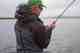 black flies swarming fisherman