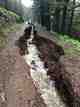 Every road and its drainage ditch intercepts shallow groundwater.  If not maintained it will erode, intercept more, and become a channel